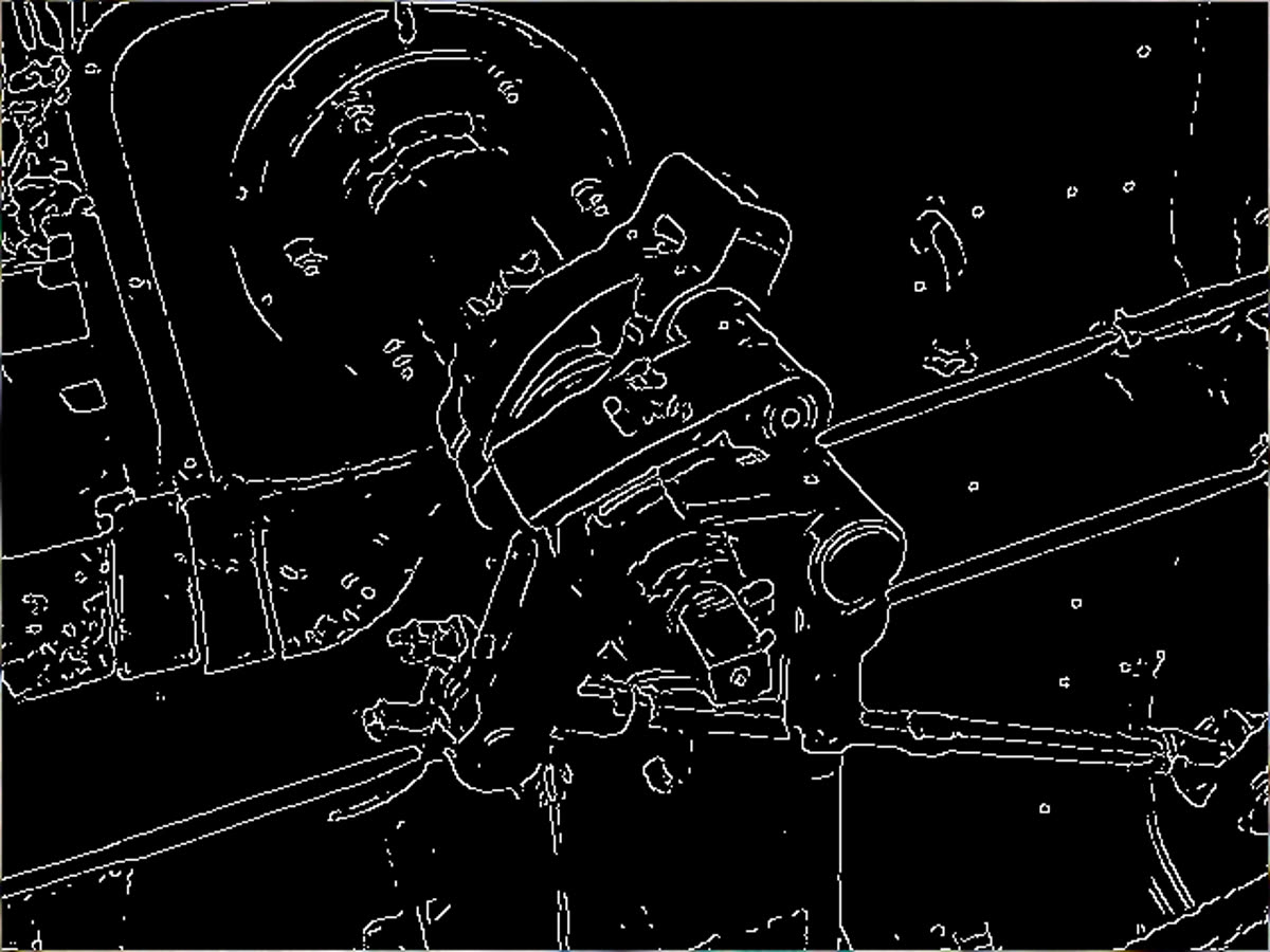 A Canny edge detector applied to a photograph of a steam engine, leaving only line drawings of the contours